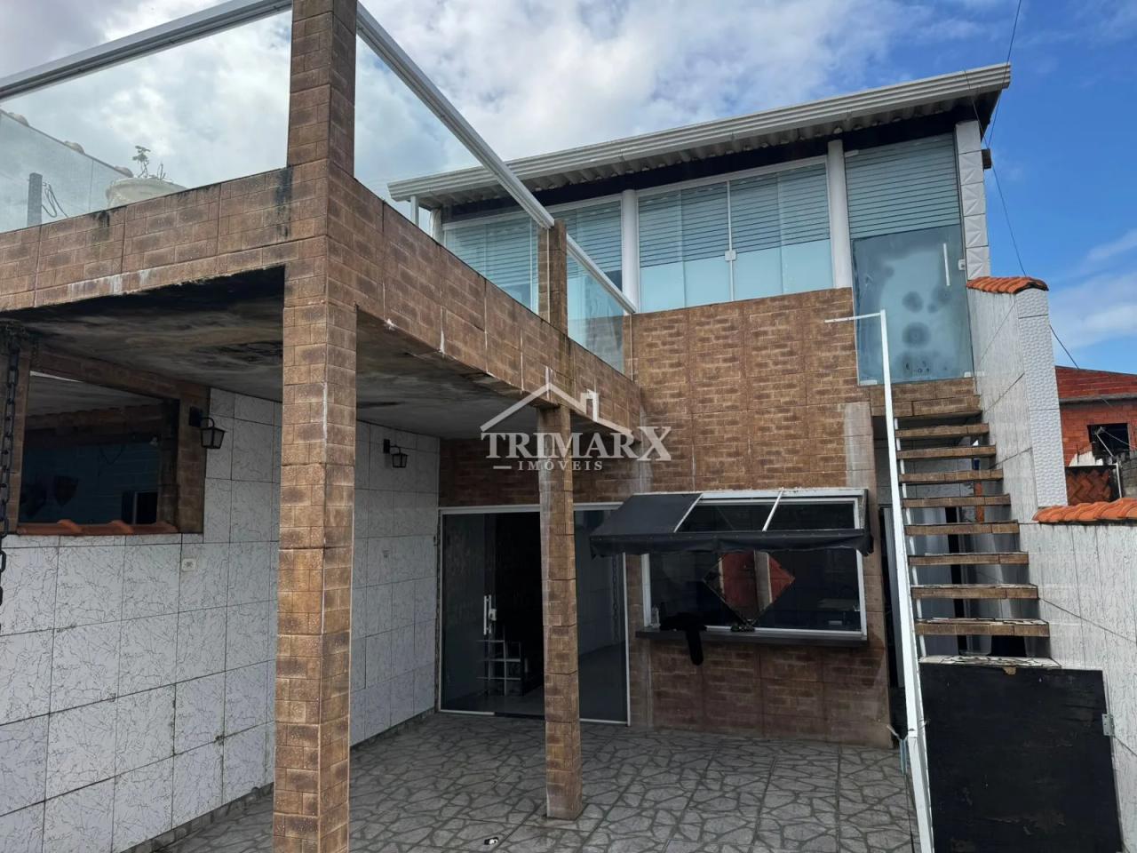 Casa no bairro São João Batista em Peruibe, lado pôs linha, em rua pavimentada. Imóvel com 125m² de área total — foto 1
