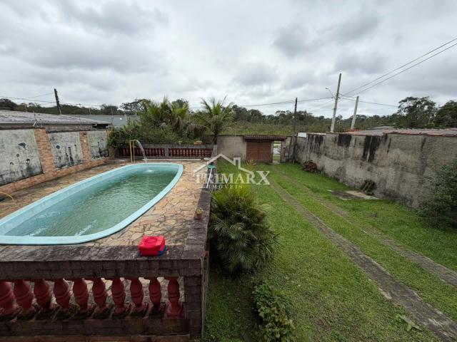 Casa no bairro Jardim Coronel, em Itanhaém, no litoral sul de São Paulo, lado serra,  a 2,5 km da rodovia e a 4 km do mar, em rua pavimentada. Imóvel com 570 m² de área total,. — foto 3