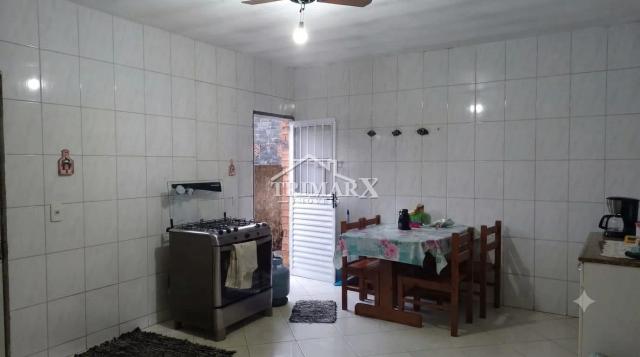 Casa no bairro Savoy, em Itanhaém, lado serra, a 600 metros da rodovia, em rua pavimentada. Imóvel com 135,50 m² de área total,. — foto 4