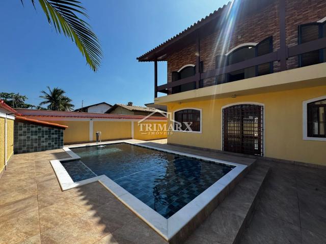 Casa no bairro Parque Augustus, em Itanhaém, lado praia, a 100 metros do mar, em rua pavimentada. Imóvel com 409,69 m² de área total. — foto 2