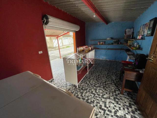 Casa no bairro Caraguava, em Peruíbe, em rua pavimentada. Imóvel com  310 m² de área total — foto 5