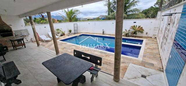 Casa no bairro Nova Peruíbe, em Peruibe, lado praia, a 1000 metros do mar, em rua pavimentada. Imóvel com 336 m² de área total. — foto 4